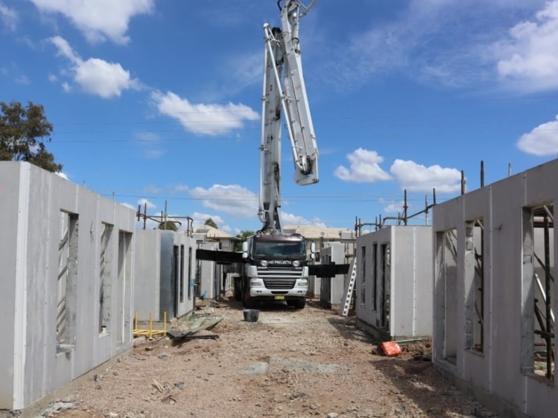 Construction site with concrete walls showcasing formwork finishes.