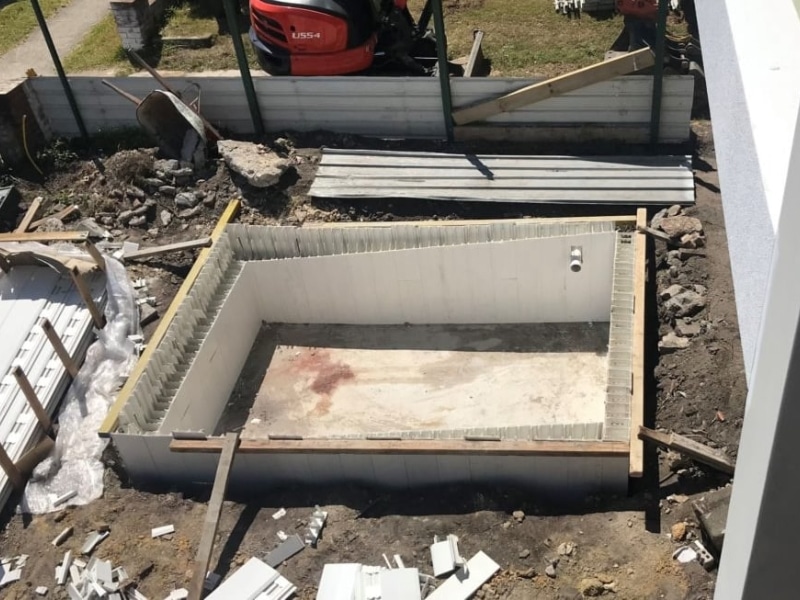 Swimming pool under construction using reinforced concrete formwork design for structural strength