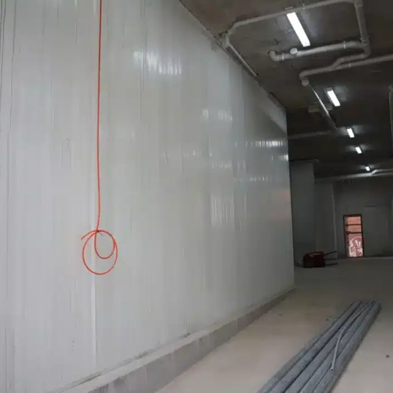 Smooth, interior load bearing panel wall installed in a commercial space, showing high-quality structural finish.
